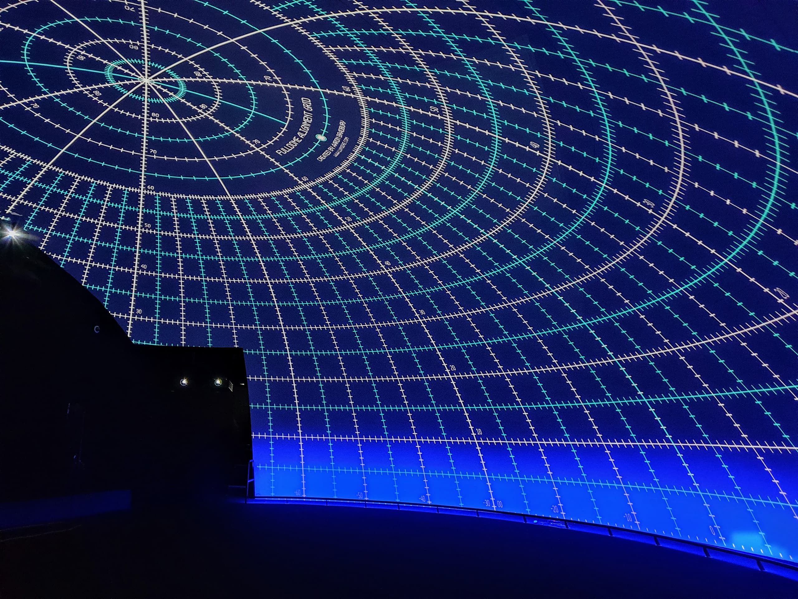 A custom shaped dome screen with a Screenberry calibration grid