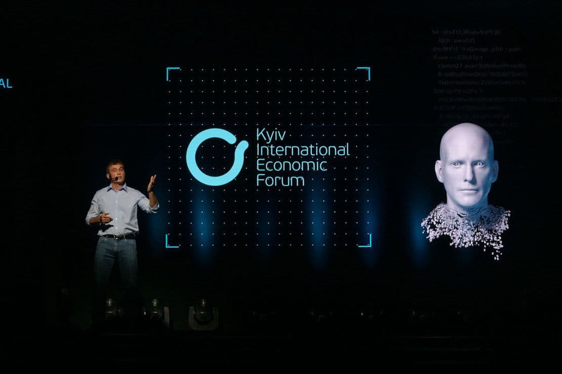 A man standing on stage as part of a live Screenberry-driven holographic presentation at the Kyiv International Economic Forum