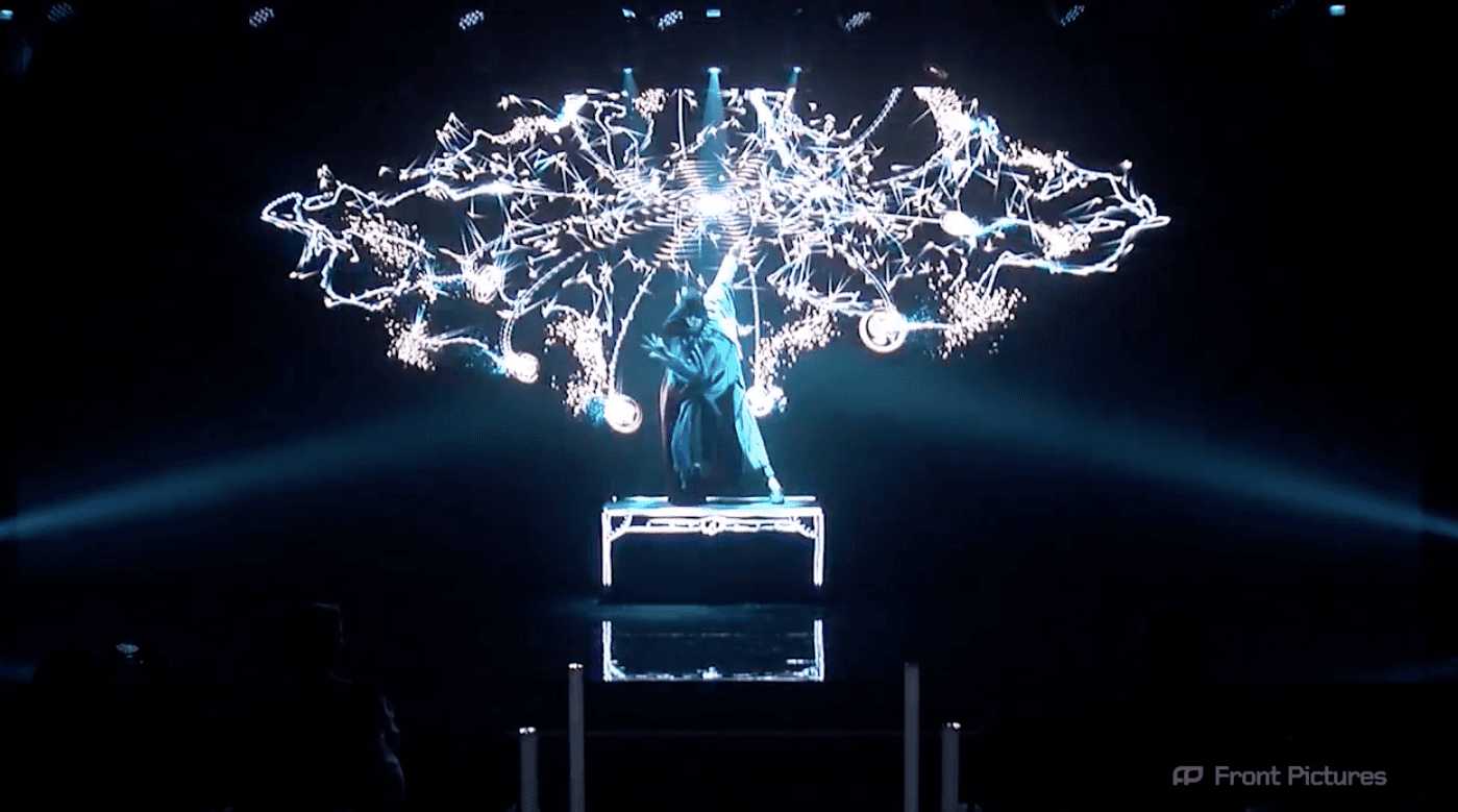 A performer interacting with an LED screen as part of the Screenberry-powered "Magic Journey" multimedia performance