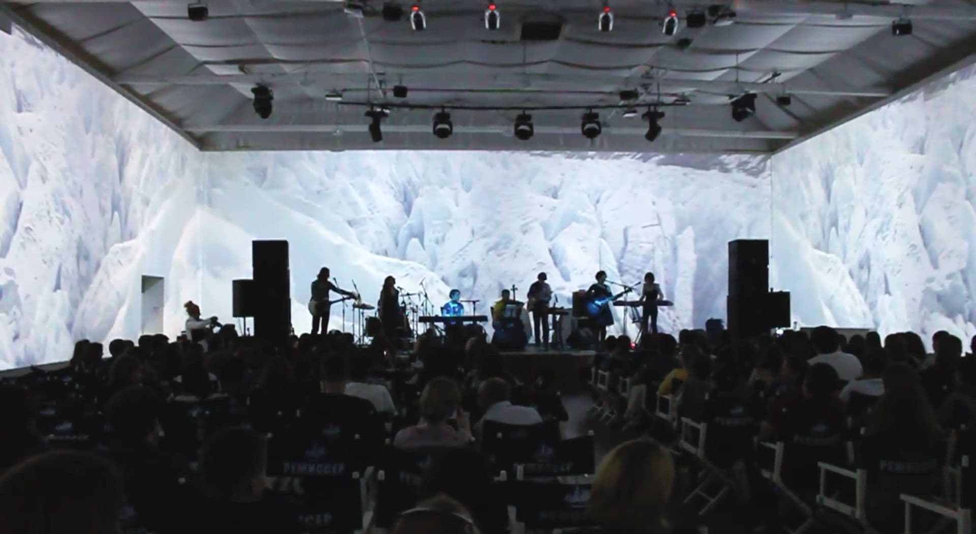 Musicians perform on stage in front of Screenbery-driven immersive projections at Odessa Film Studio