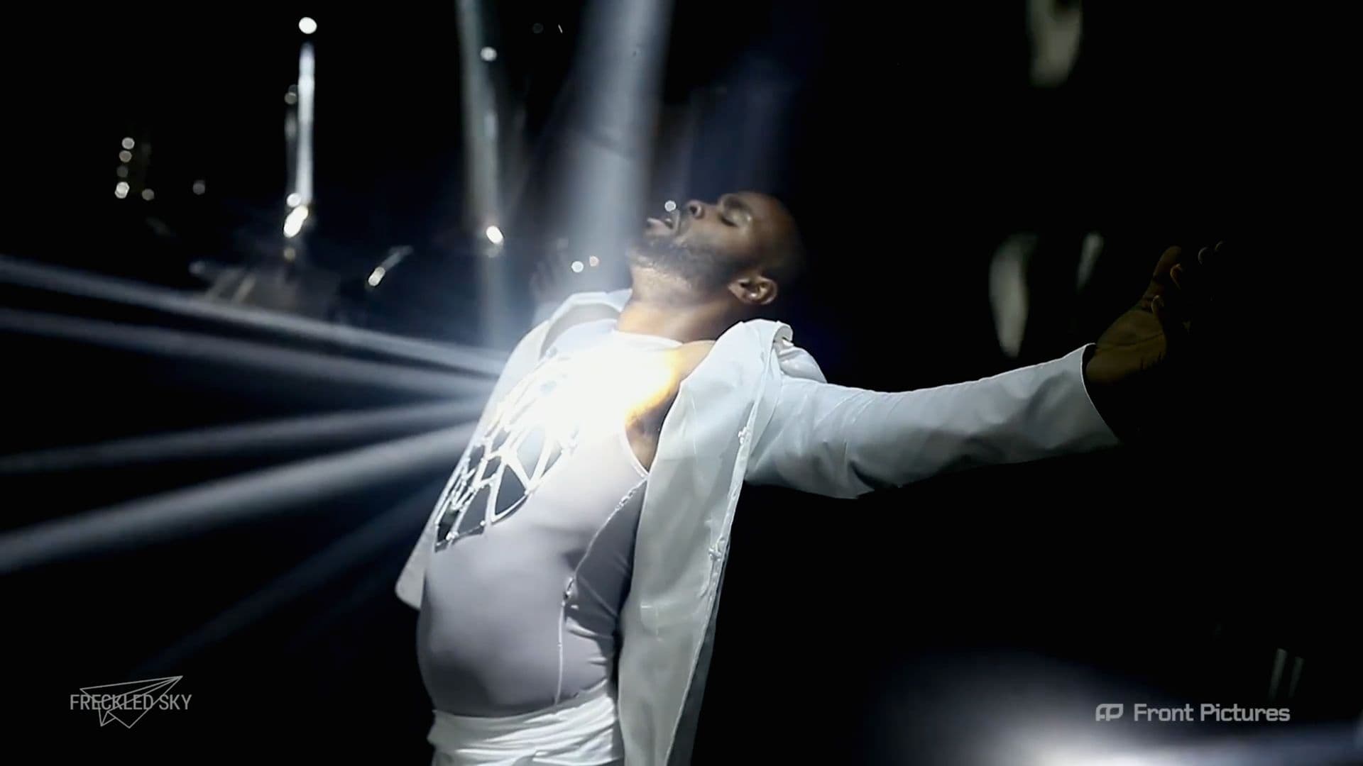 A dancer in the spotlight during a multi-screen Supercar launch tour presentation powered by Screenberry